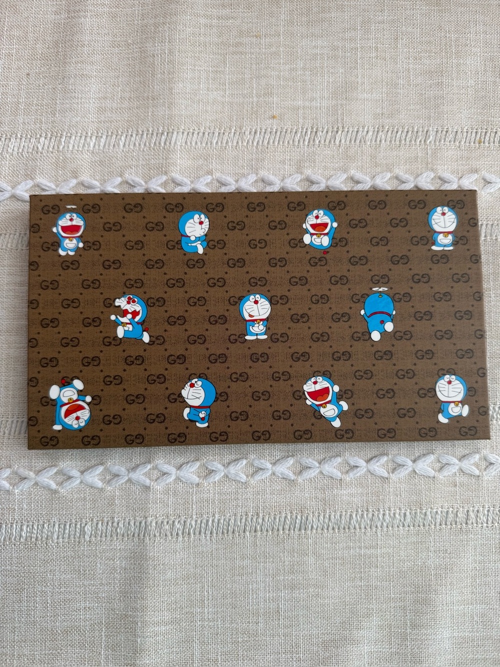 Gucci x Doraemon Monogram Wall Panel with Blue Doraemon Motifs notebook paper.
